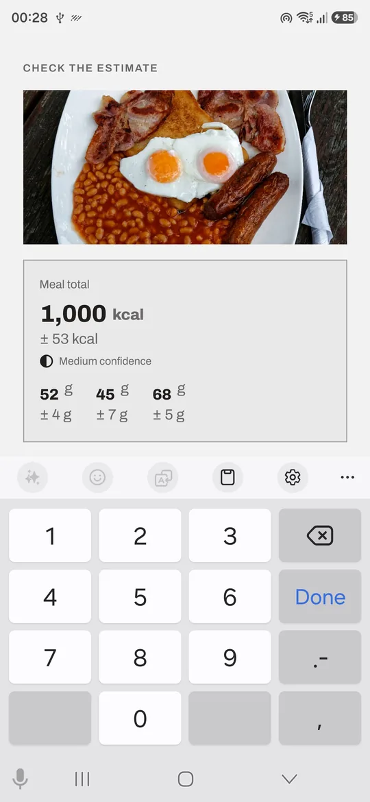 A scanned meal in MunchMetrics showing 1,000 kcal plus or minus 53, marked medium confidence, with protein, carbs and fat broken out below.